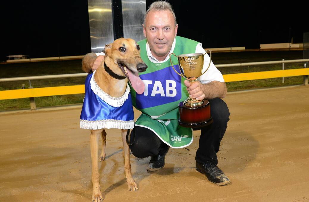 GRINNER: Orson Allen with handler Joe Briffa and the Horsham Cup trophy. Picture: CLINT ANDERSON