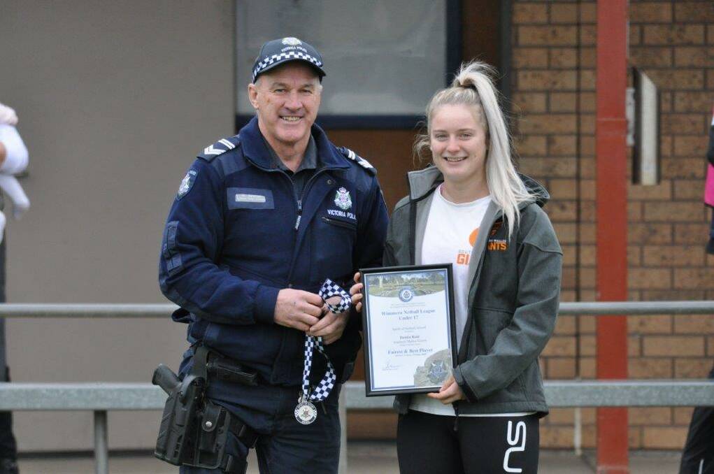 RECOGNITION: Southern Mallee Giants netballer Denita Reid receives her award from Hopetoun police's Sergeant Phil McClure.