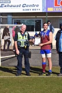 RECOGNITION: Dyson Parish is presented with his award from Horsham police officer Acting Sergeant Rob Martin. 