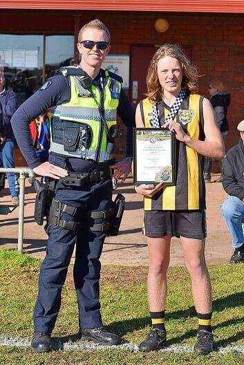 RECOGNISED: Pimpinio's Brayden Webb receives his award from Horsham police Constable Sam Foster.