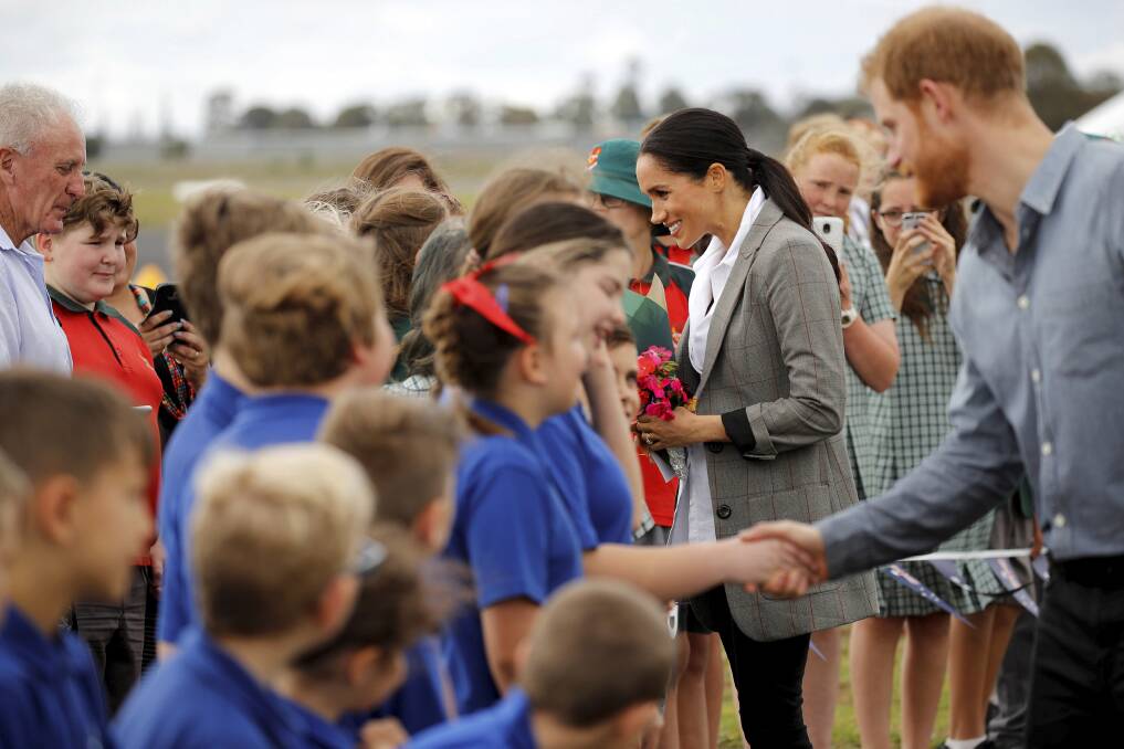 Meet and greet: The Duke and Duchess of Sussex seemed at ease with people of every age and situation in life.