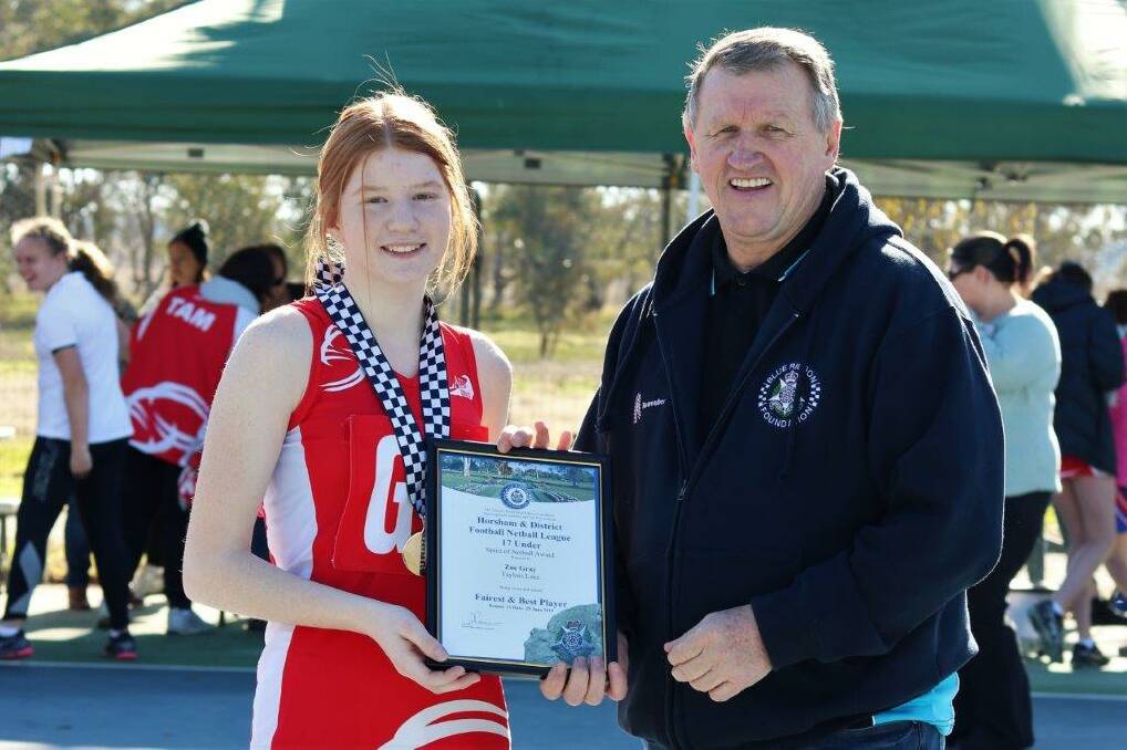 HONOUR: Taylors Lake under 17 netballer Zoe Gray is presented with her award by Blue Ribbon Foundation member Les Power. Picture: SUPPLIED