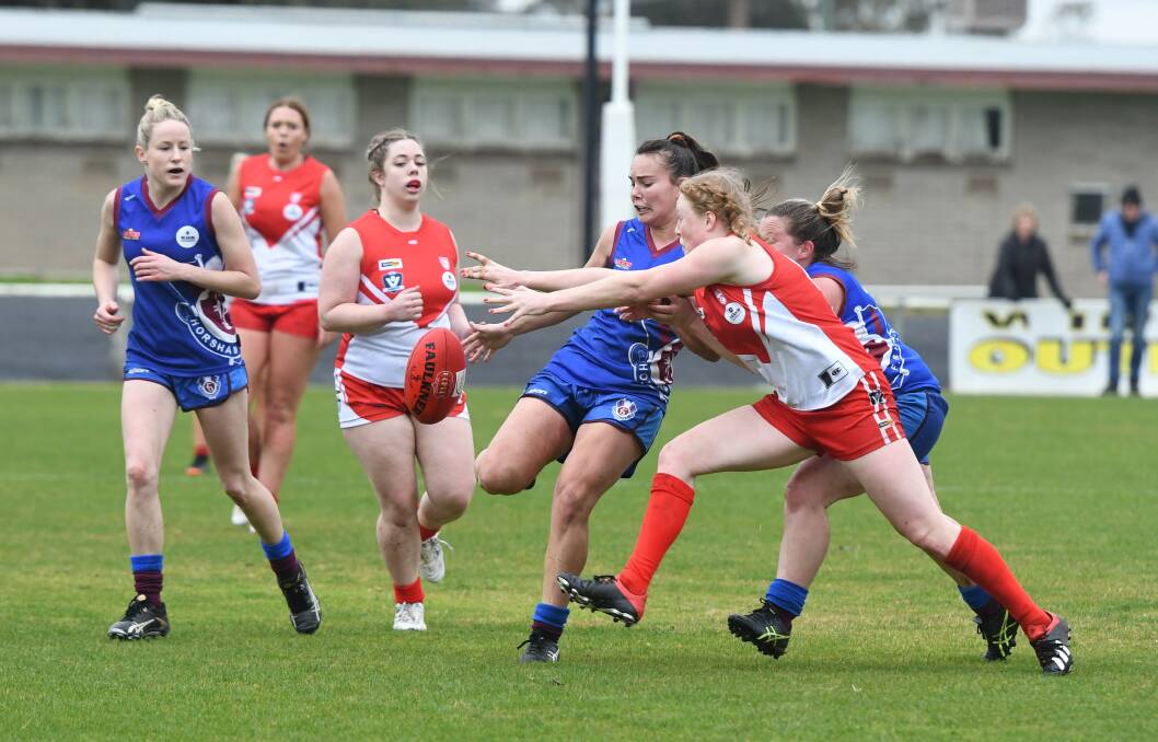 Horsham Demon Meaghan Pohlner manages to get a kick away during the 2019 season. 