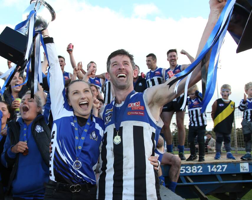 CHAMPIONS: Bille Bibby and John Delahunty
celebrate the Burras' 2019 premierships.
Picture: PETER PICKERING
