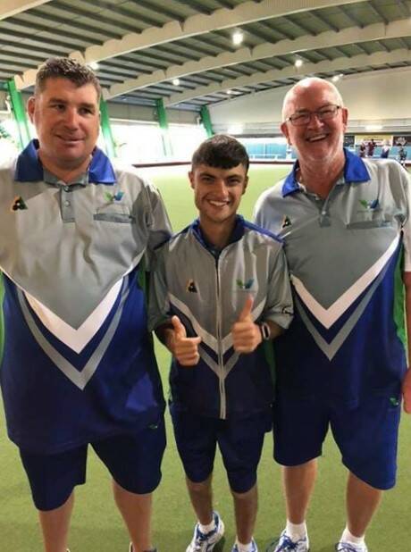 Horsham's Josh Barry celebrates his gold medal in the triples at the multi-disability National Championships with his partners Lucas Protopapas and Barry Brennan. Picture: CONTRIBUTED