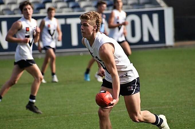 Ben Hobbs gets a a handball away while playing for Vic Country at the weekend. Picture: CONTRIBUTED