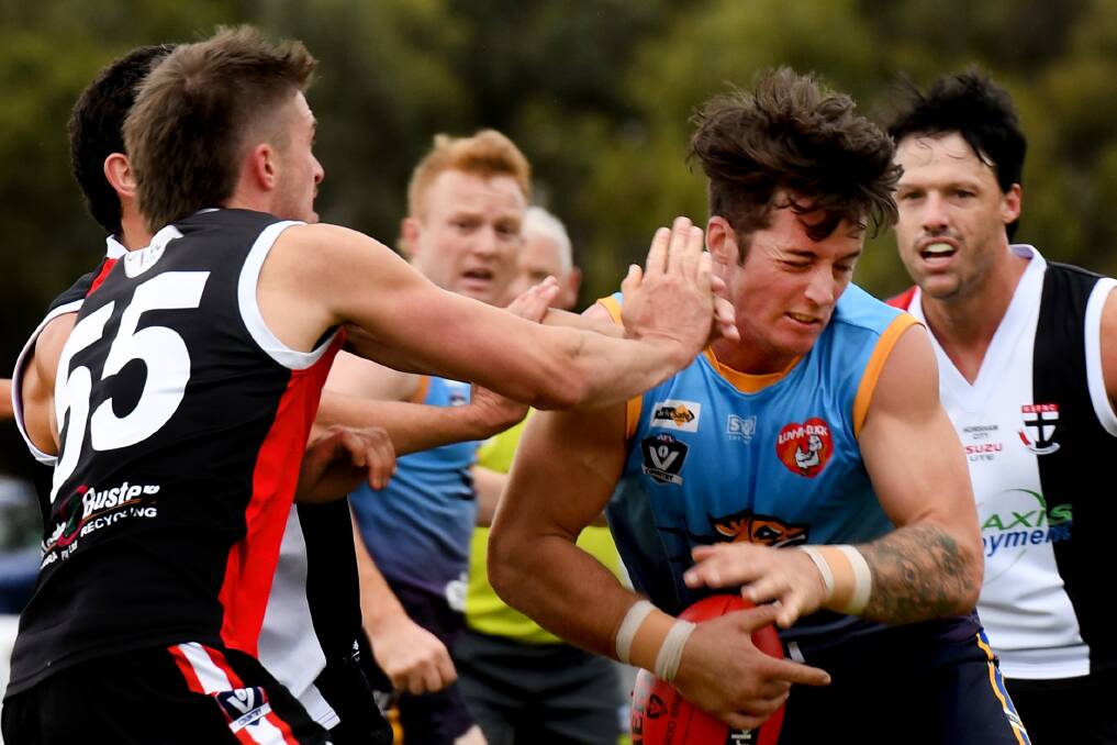 Nhill's Toby Case catches a hand to the face. Picture: SAMANTHA CAMARRI