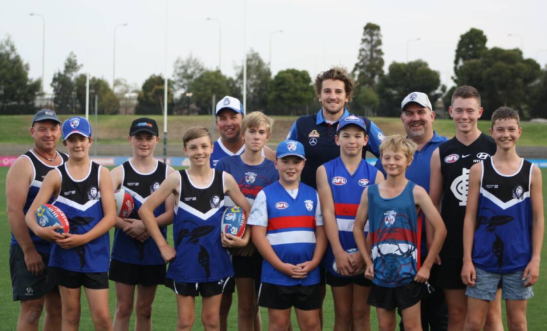 Jack French and his Minyip-Murtoa teammates share a moment with Marcus Bontempelli. Picture: CONTRIBUTED