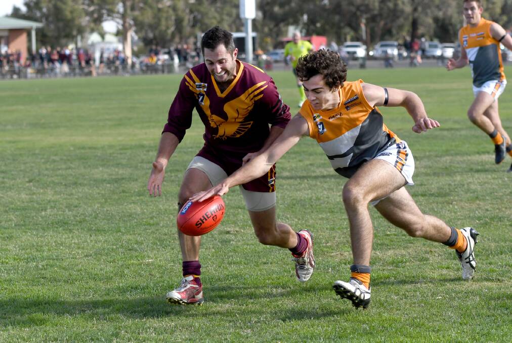 White competes with Warrack Eagles' Christopher Kellett for the ball in 2018. Picture: SAMANTHA CAMARRI