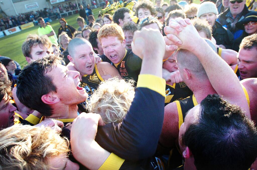 Pimpinio players celebrate during the 2006 grand final. 