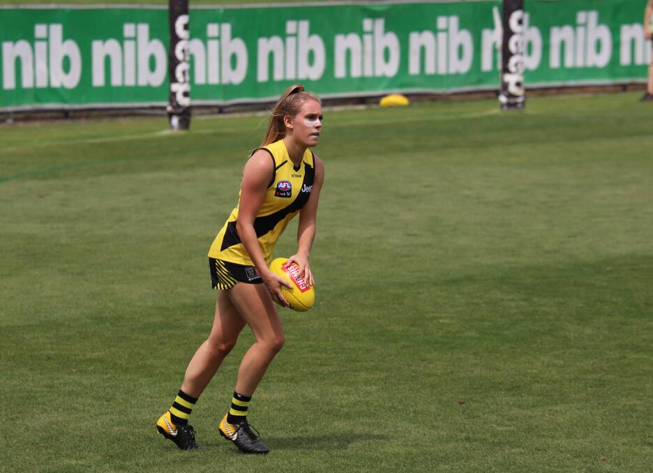 LOOKING AHEAD: Ella Wood in action for the Richmond Tigers last season. Wood has retired from football. Picture: RICHMOND MEDIA