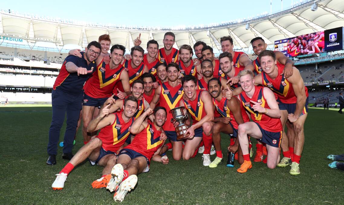 Horsham's Chris Curran, fourth from left, celebrates with his SANFL team. Picture: GARY DAY/WAFL