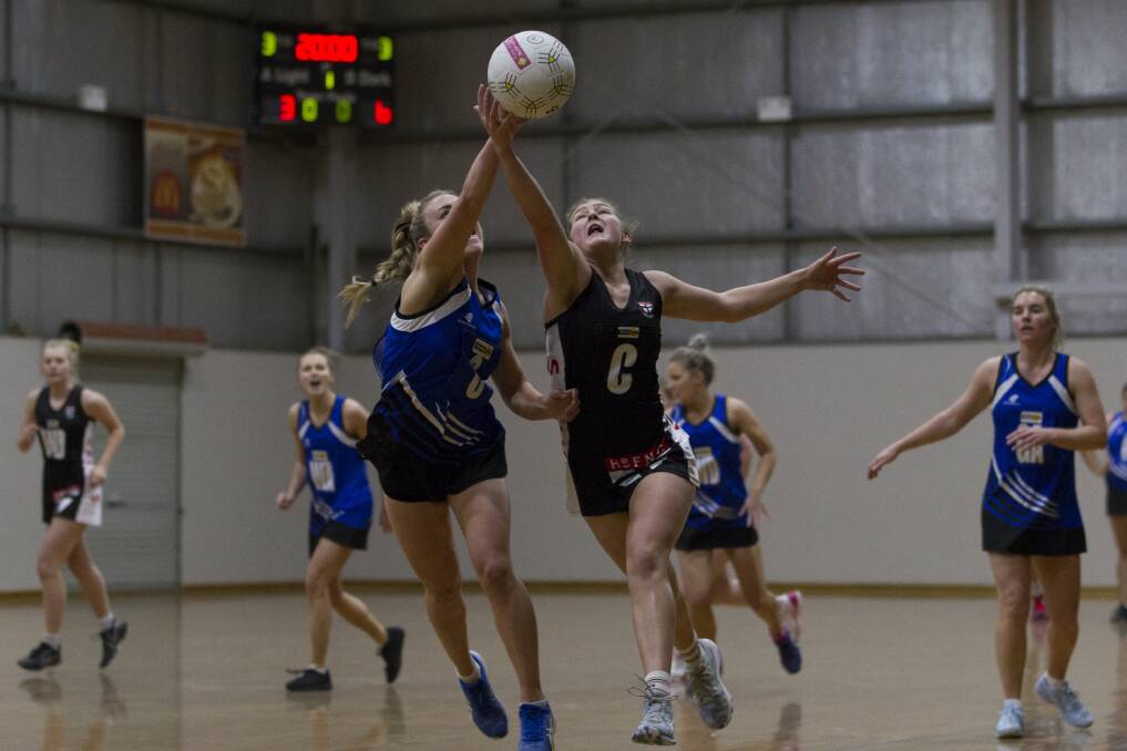 Hayley Campbell and Ashlee Grace contest the ball. Picture: PETER PICKERING
