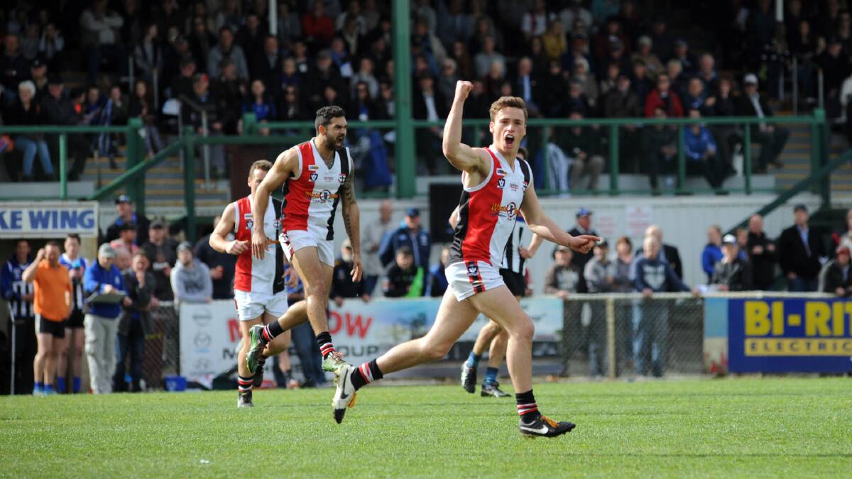 Kyle O'Connor celebrates kicking a goal in the 2016 grand final. 