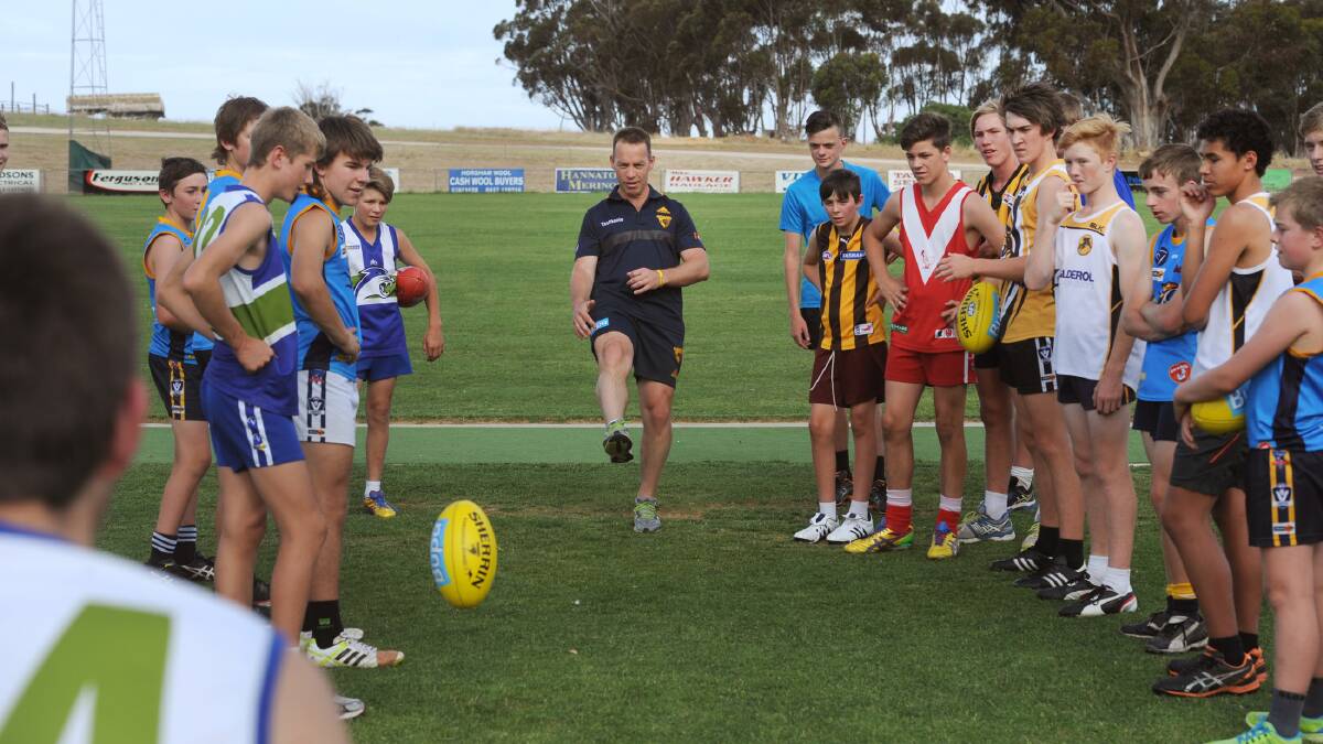 Alastair Clarkson passes on trips during a training clinic at Kaniva. Picture: FILE