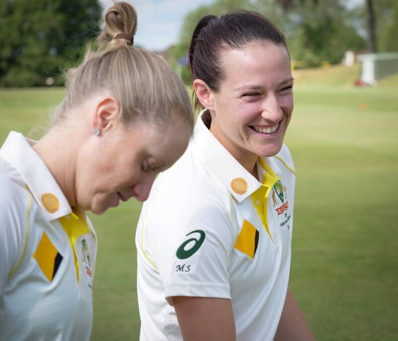 Australian cricketers Alyssa Healy and Megan Schutt model the shirts with Walkabout Wickets on the collar. Picture: CRICKET AUSTRALIA