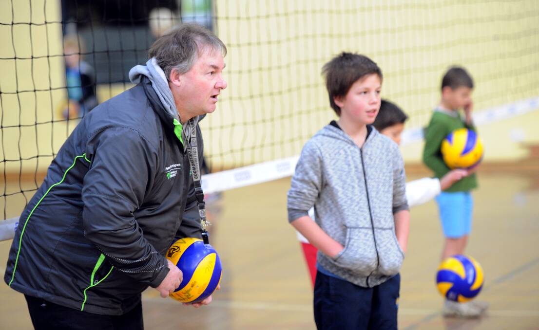 NEW ROLE: David Berry, pictured passing on advice to a young volleyballer, will step into the Phantoms' men's coaching ranks. 