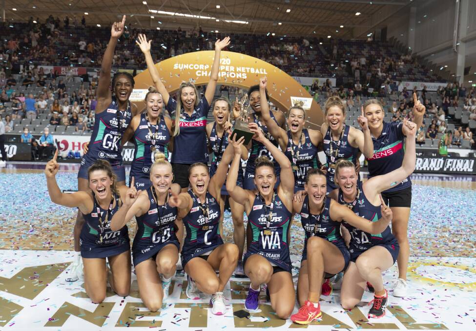 PREMIERS: The Melbourne Vixens and Sacha McDonald (back, right) celebrate their Super Netball title. Picture: BARRY ALSOP/MELBOURNE VIXENS