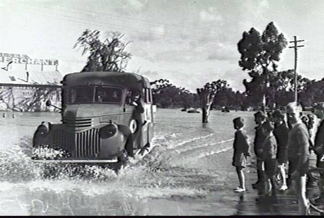 A WAAF recruiting van plows through a flooded Firebrace Street in 1942. Picture: AUSTRALIAN WAR MEMORIAL