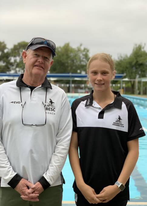 Lily Eldridge with Bendigo East Swimming Club coach Chris Geyer. Picture: CONTRIBUTED