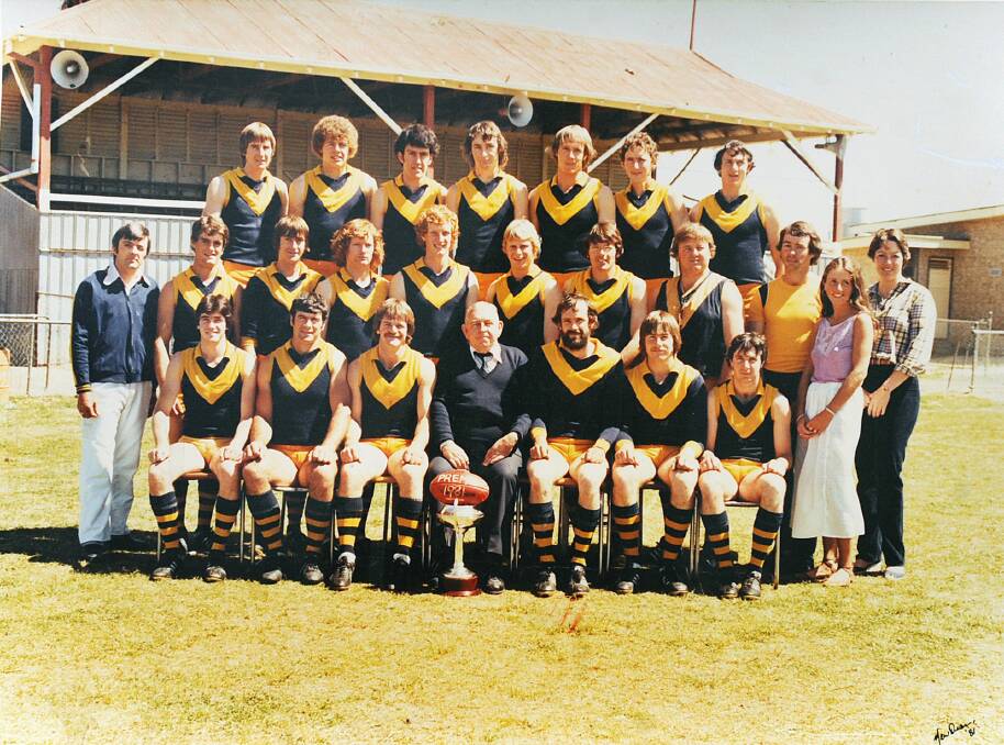 Nhill's 1981 premiership team pose in front of the now condemned grandstand.