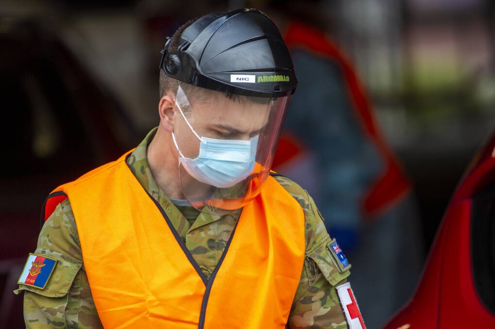 EXTRA HELP: A member of the Australian Defence Force working at Bendigo Health's drive thru COVID-19 screening clinic. Picture: DARREN HOWE/BENDIGO ADVERTISER