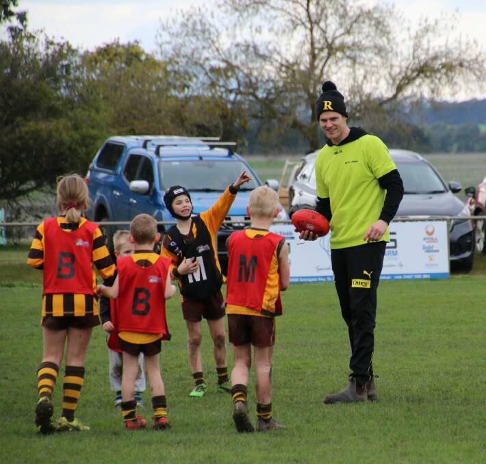 GIVING BACK: Richmond premiership player David Astbury on a trip back to Tatyoon. Picture: TRACEY KRUGER
