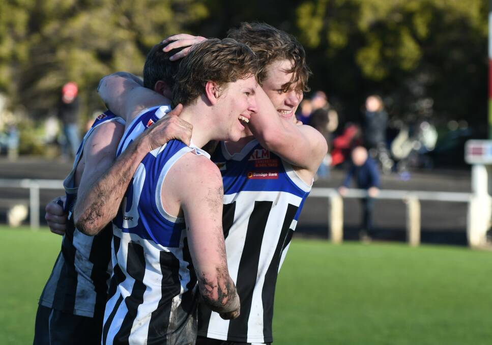 Burras players celebrate after the 2019 grand final win. 