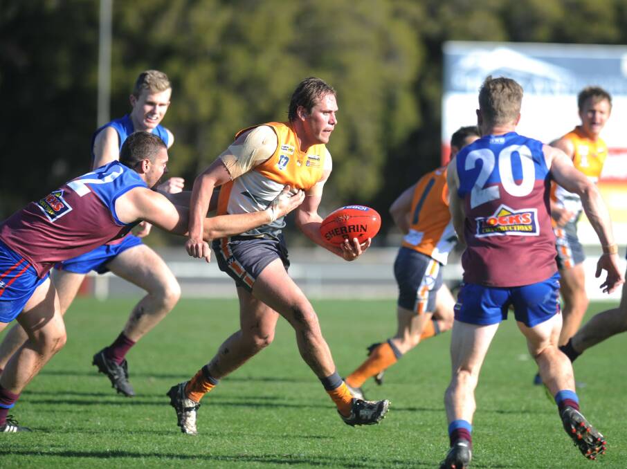Tyler Lehmann bursts through Billy Carberry's tackle. Picture: MATT CURRILL