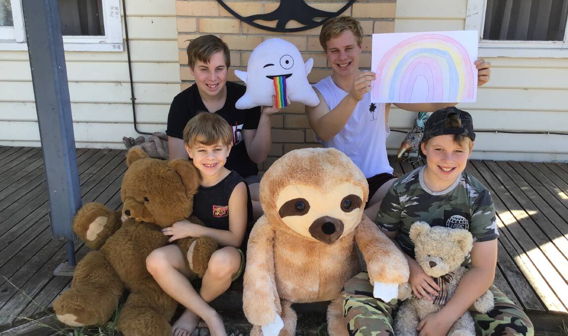 FAMILY EFFORT: The Fischer children Angus, Damon, Lincoln and Deagan spread joy with rainbows, bears and letters during the first lockdown earlier this year. Picture: SUPPLIED