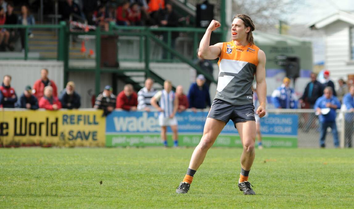 Brock Orval celebrates a goal during the 2016 HDFNL grand final.