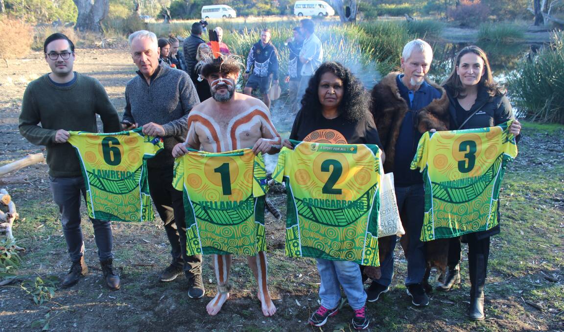 HISTORY: Aunty Fiona Clark, third from right, with other descendants of the pioneering Indigenous XI display the Indigenous team's shirts at a ceremony in Harrow in 2018. Pictures: CRICKET AUSTRALIA