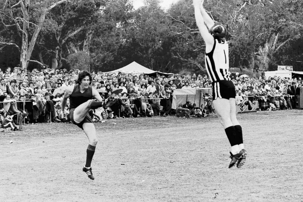 A Murtoa defender leaps to try and affect the kick on the mark.
