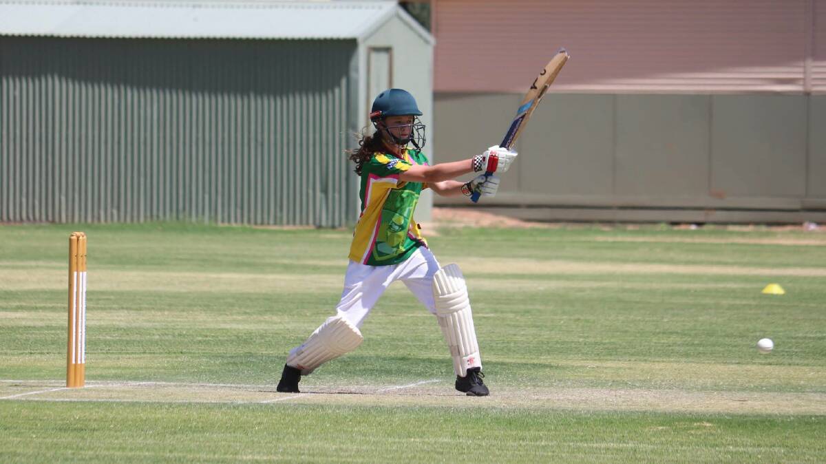 SAVE YOUR LEGS: Abby Griffith smokes one into the offside. Picture: AMANDA REID