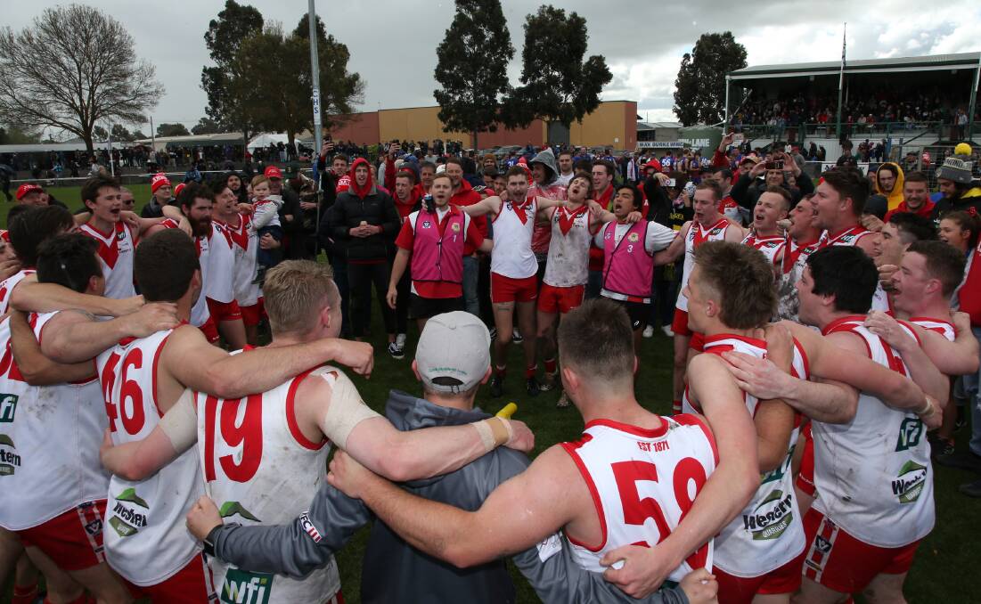 Ararat's premiership-winning reserves side celebrates with supporters after the 2019 grand final. Picture: PETER PICKERING