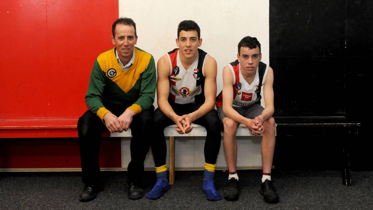 Mark O'Beirne with sons Jacob and Connor ahead of the 2013 Wimmera league finals. Picture: SAMANTHA CAMARRI