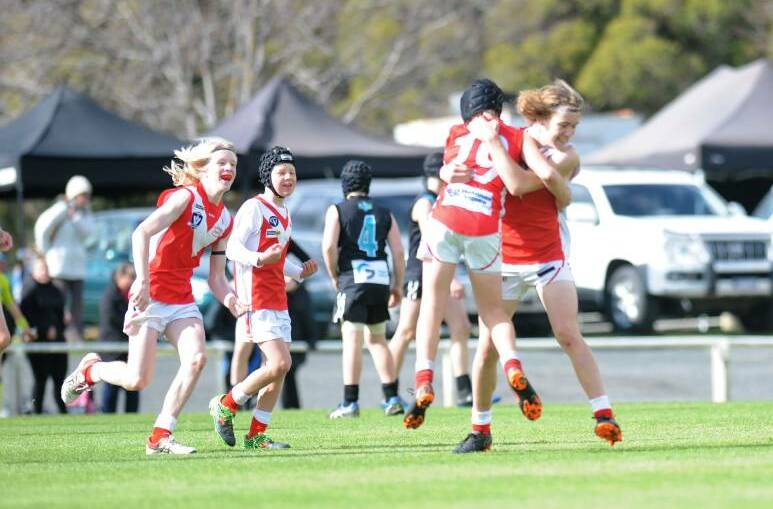 Taylor's Lake under-14 players celebrate in last season's grand final. 