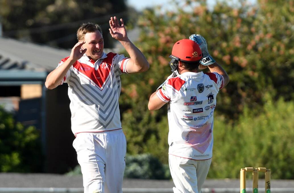 Homers' Jason Kannar and Adam Atwood celebrate a wicket during the 2019-20 grand final. Picture: MATT CURRILL