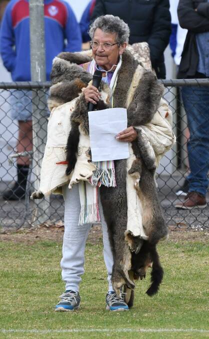 Aunty Nancy Harrison performing a welcome to country before Dimboola took on Horsham. Picture: MATT CURRILL