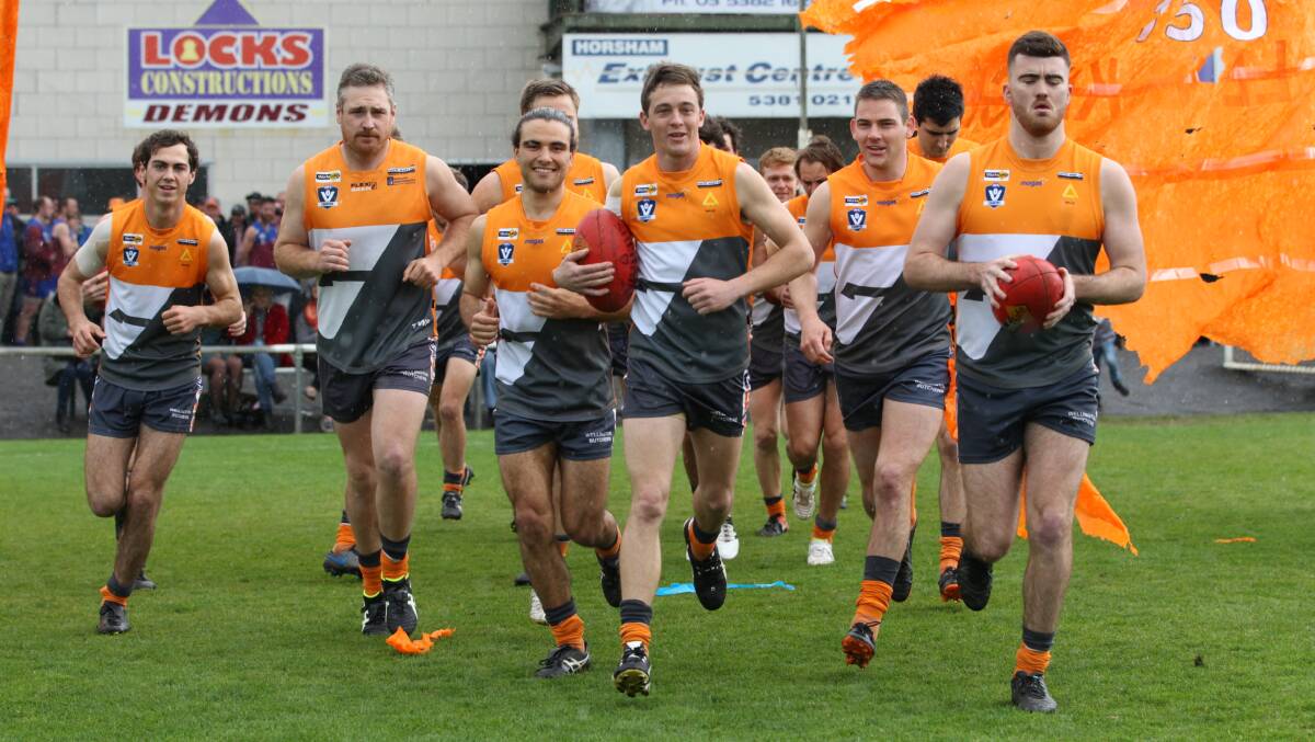 The Giants take to the field for the 2019 WFL grand final. Picture: PETER PICKERING