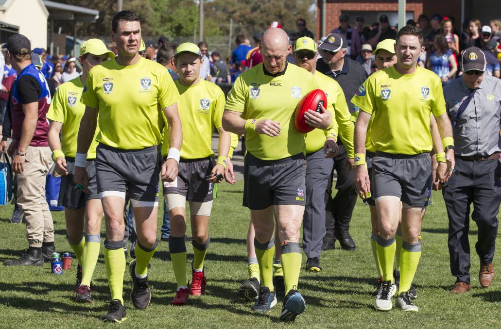 The umpires take to the ground in last season's Wimmera Football League grand final. Picture: PETER PICKERING