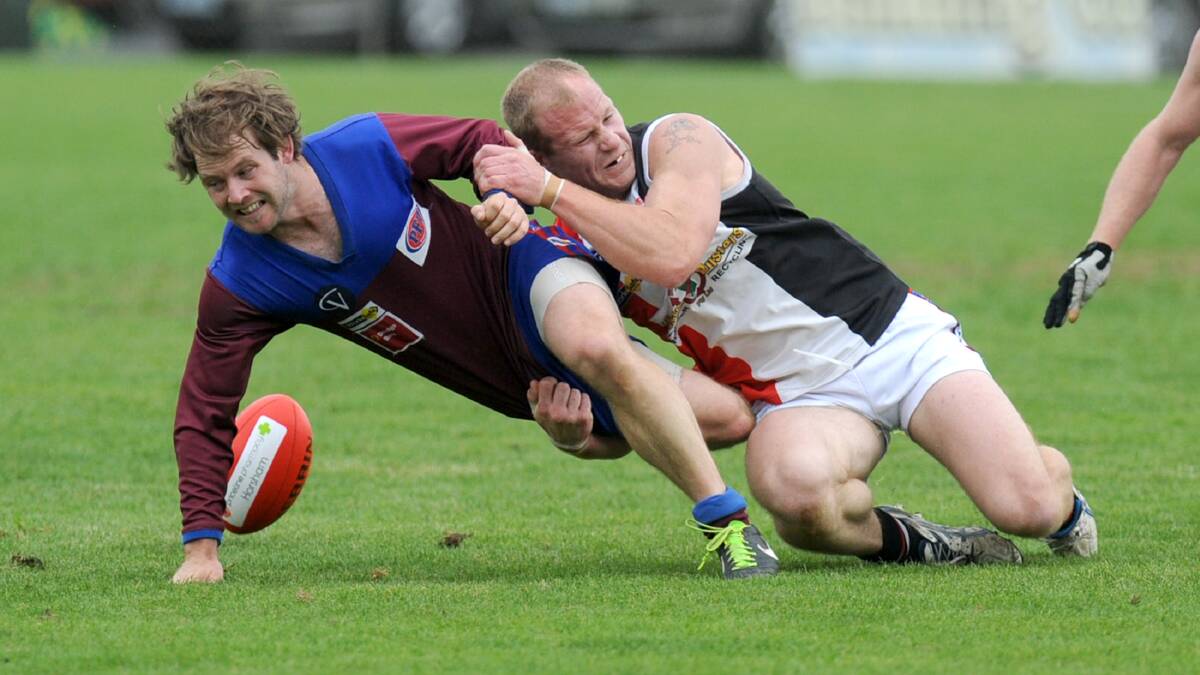 Phil Butsch tackles Horsham's Jye Smith in 2013. 