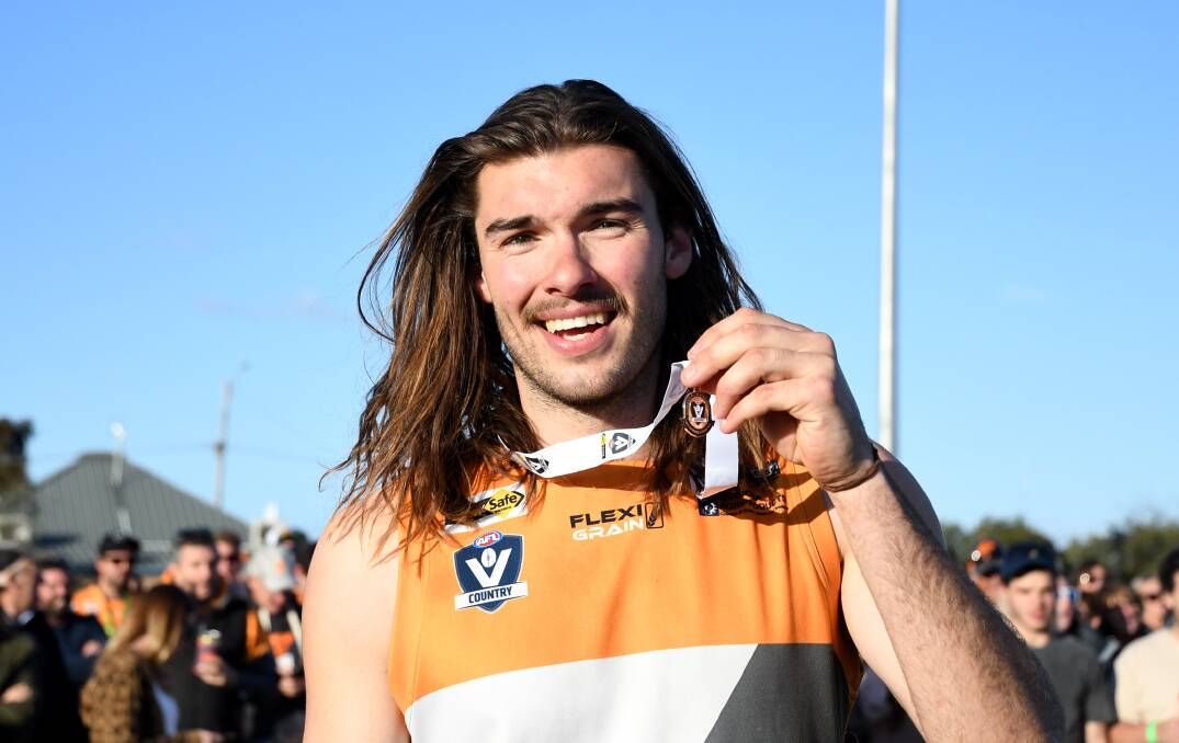 Sam Weddell celebrates after being named best on ground in the 2017 HDFNL grand final. 