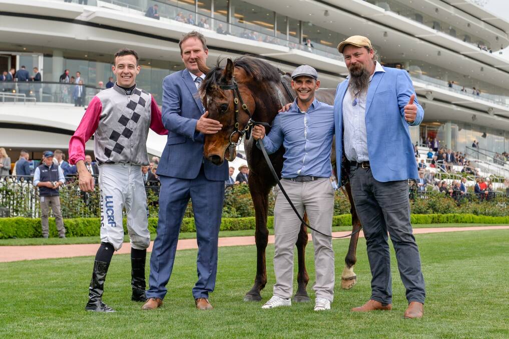 Jordan Childs and Paul Preusker with Surprise Baby after winning the The Bart Cummings. Picture: REG RYAN/RACING PHOTOS