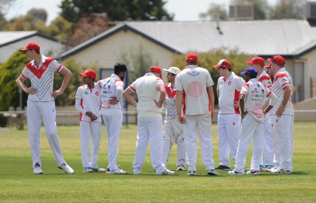 Homers re-group after claiming an early wicket against the Horsham Saints. Picture: MATT CURRILL