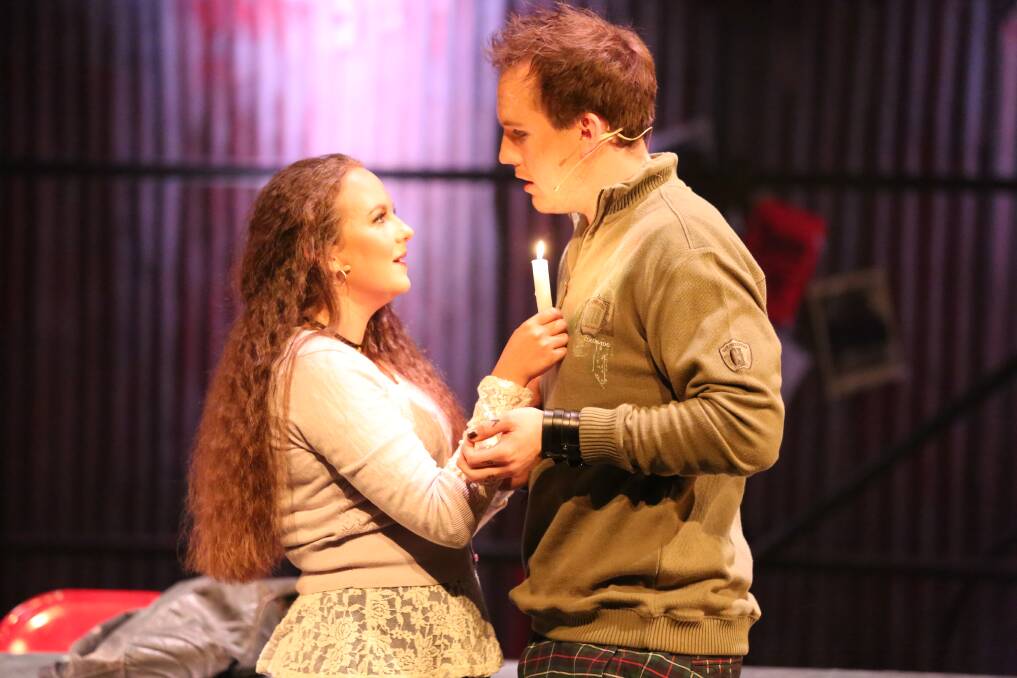 Erin Boutcher, who plays Mimi, and Brady King, who plays Roger, sing together in Rent. Picture: AMANDA WILSON