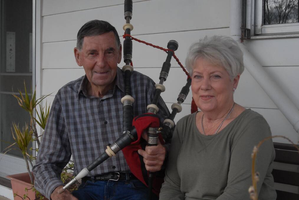 GREAT PASSION: Ron Abbott with the two loves of his life - his wife Shirley and his bagpipes. Picture: PRU SAIMOUN