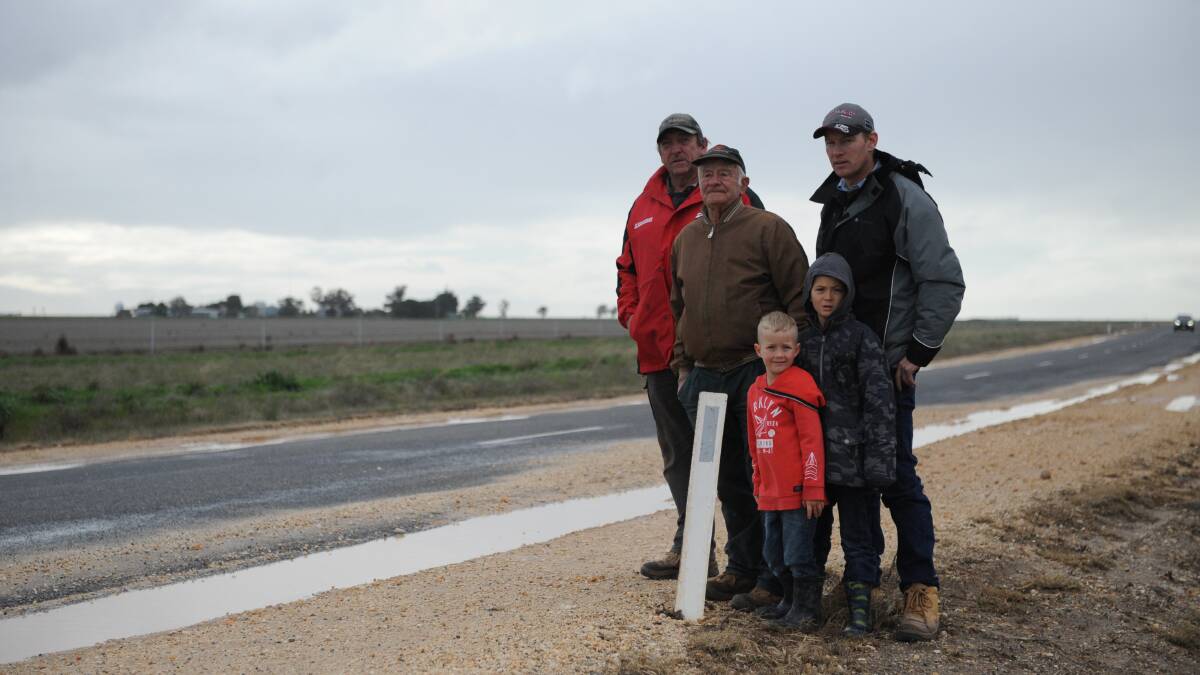 CONCERNED: Residents Greg Lawson, Tom Blair and Glenn Jenkinson with sons James and Sam on Blue Ribbon Road at Kalkee. Picture: SONIA SINGHA