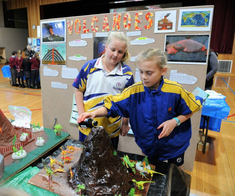 ON SHOW: Mia Geue and Macy Uebergang at Holy Trinity Lutheran College year six students' Natural Disasters Expo.