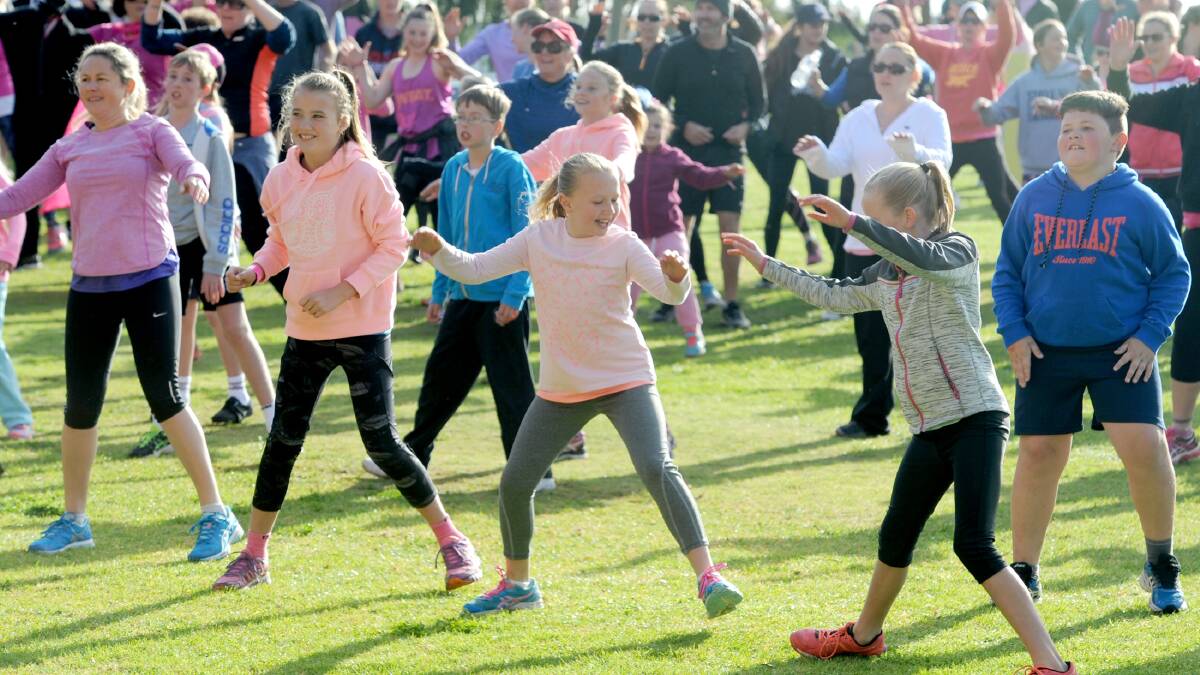 ACTIVE: Youngsters were among the people warming up at Sawyer Park in Horsham on Sunday ahead of the Mother's Day Classic run and walk. Picture: OLIVIA PAGE